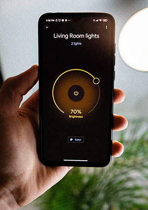 Picture of a smartphone controlling smart lights.